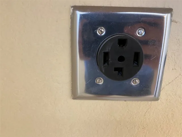 a close view of a faucet a sink and a utility room