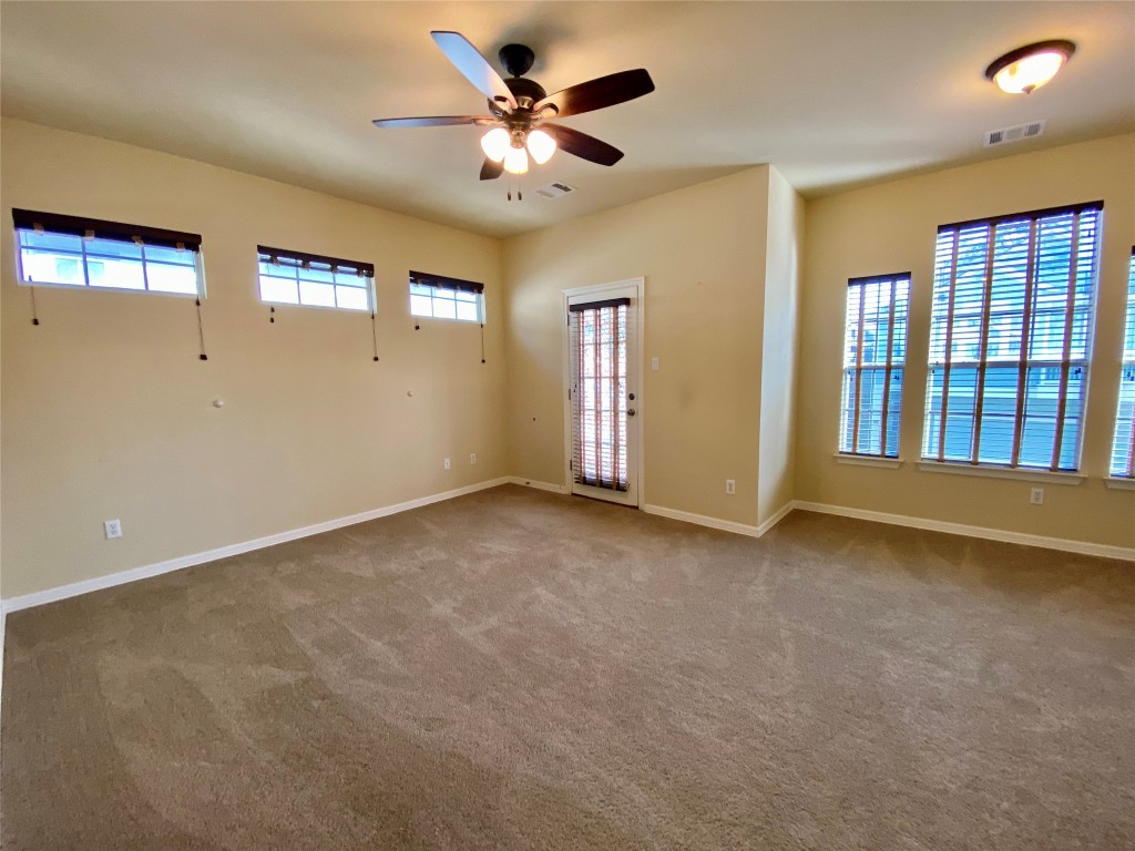 6704 Menchaca Road, Unit 8 Austin, TX 78745 - Photo 30 of 39 a view of an empty room with windows