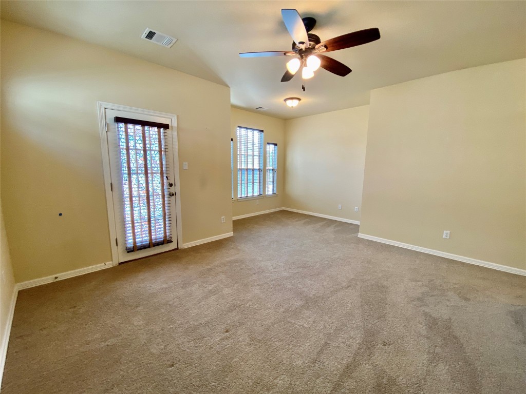 6704 Menchaca Road, Unit 8 Austin, TX 78745 - Photo 31 of 39 an empty room with windows and fan