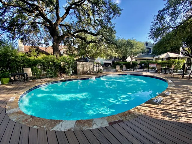 a view of a swimming pool with a garden