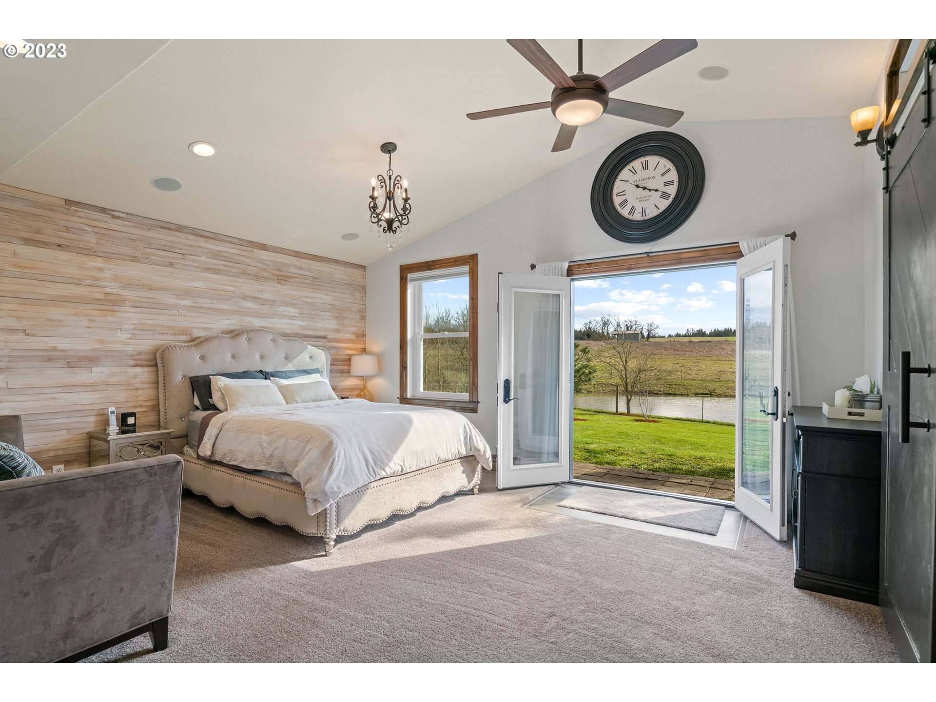 9953 South Wildcat Road Molalla, OR 97038 - Photo 15 of 41 a bedroom with a bed and a large window
