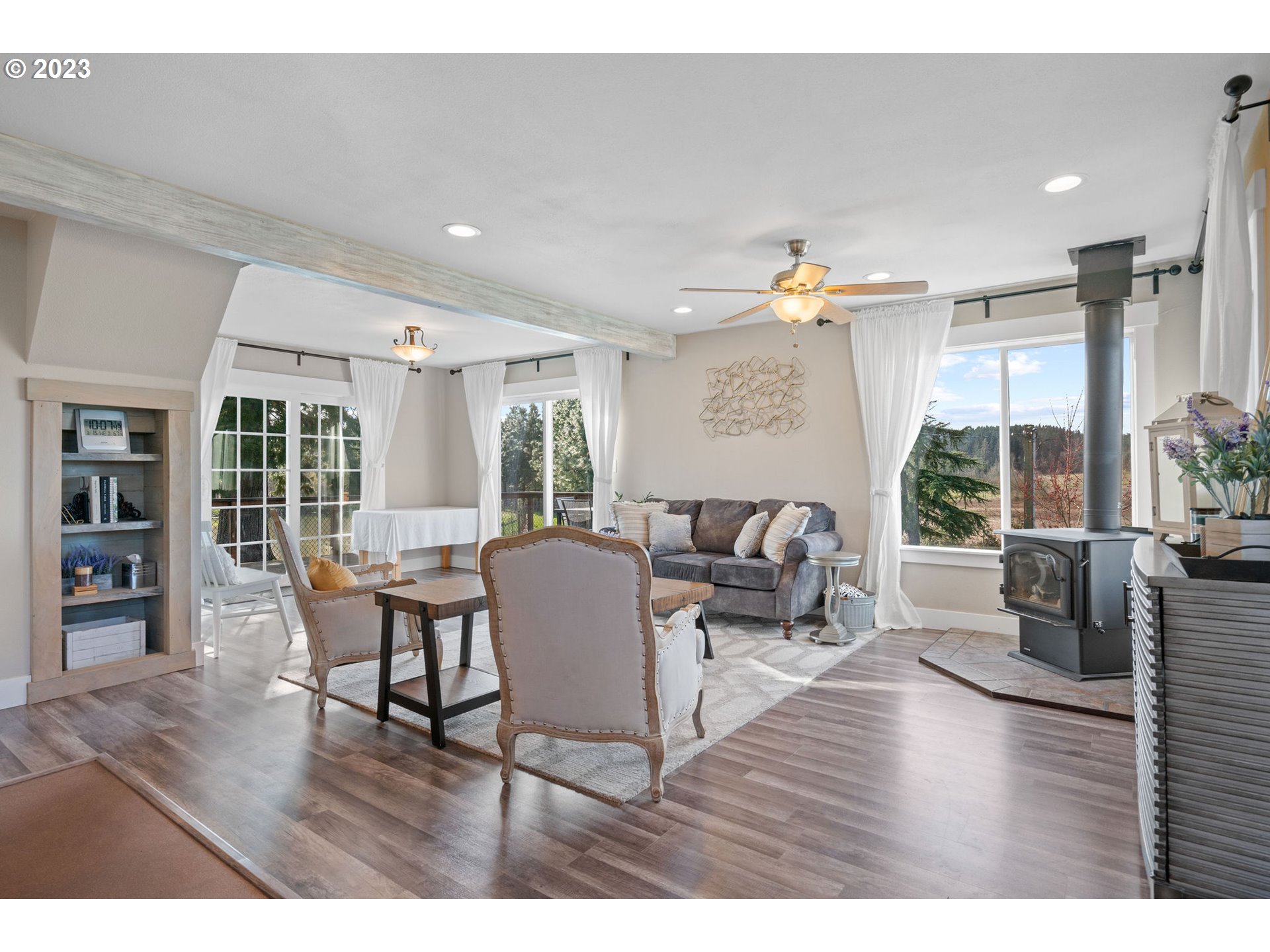 9953 South Wildcat Road Molalla, OR 97038 - Photo 6 of 41 a living room with furniture and a wooden floor