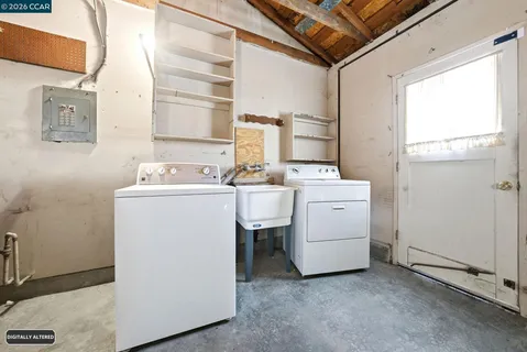 a utility room with dryer and washer