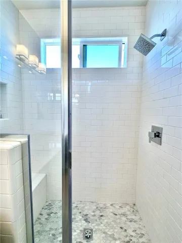 a bathroom with a shower and a toilet