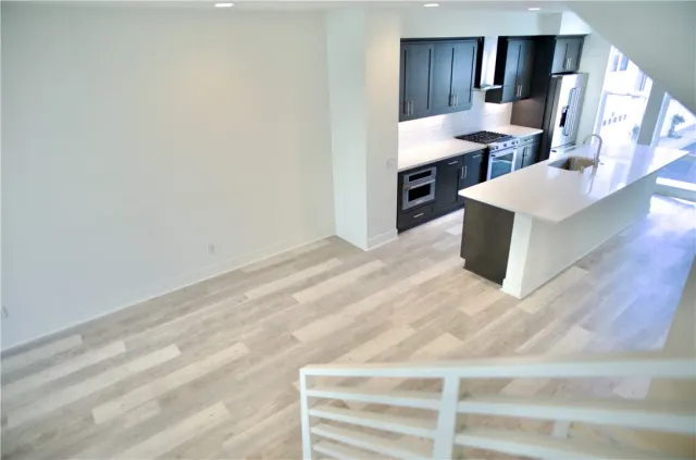 a kitchen with a sink cabinets and appliances
