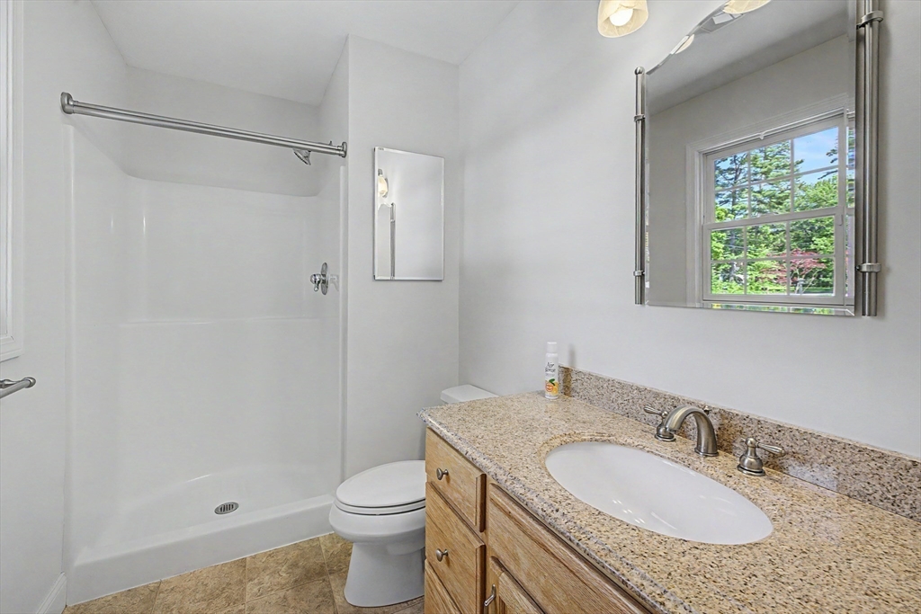 792 Ryan Road Northampton, MA 01062 - Photo 14 of 29 a bathroom with a granite countertop sink toilet and shower