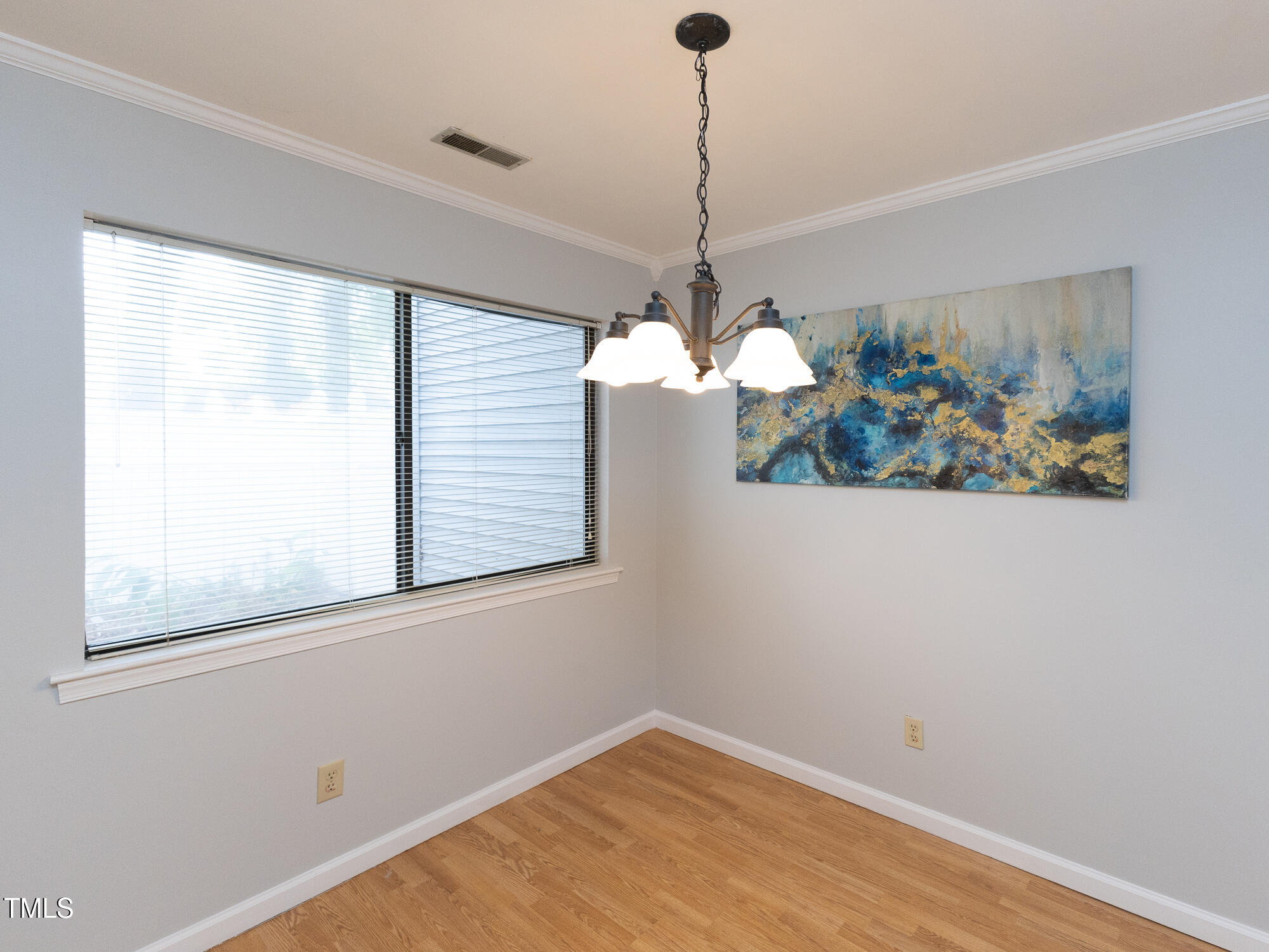 7353 Sandy Creek Drive Raleigh, NC 27615 - Photo 5 of 13 a view of a room with a window