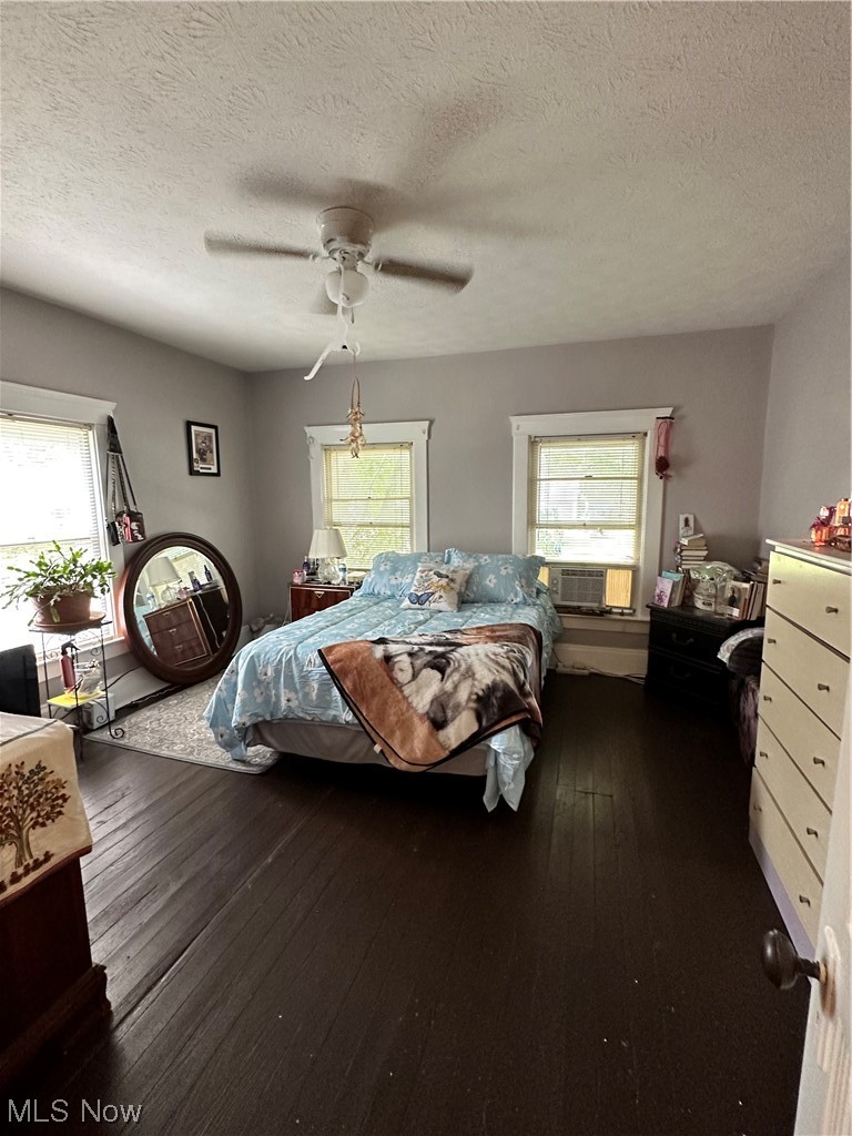 7145 Avon Belden Road North Ridgeville, OH 44039 - Photo 6 of 13 Hardwood floored bedroom with ceiling fan, multiple windows, and a textured ceiling