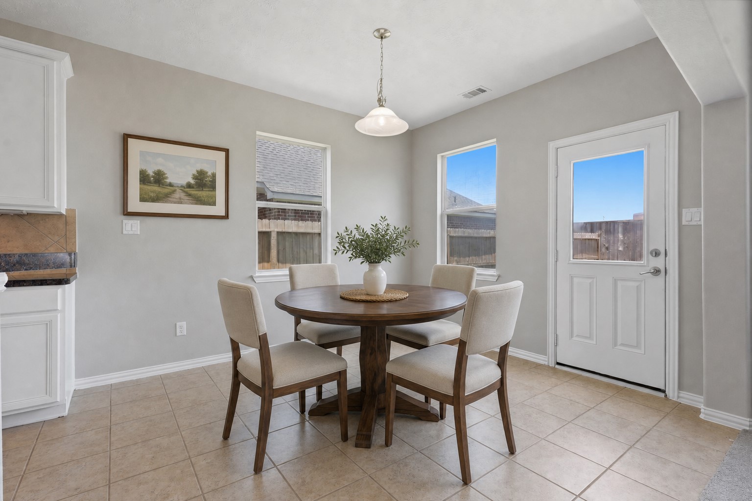 25926 Morgan Springs Spring, TX 77373 - Photo 11 of 49 Enjoy casual dining in the bright breakfast room, perfectly positioned just off the kitchen with large windows that fill the space with natural light and provide beautiful views of the private backyard. All insulated windows! **Photo is Virtually Staged**