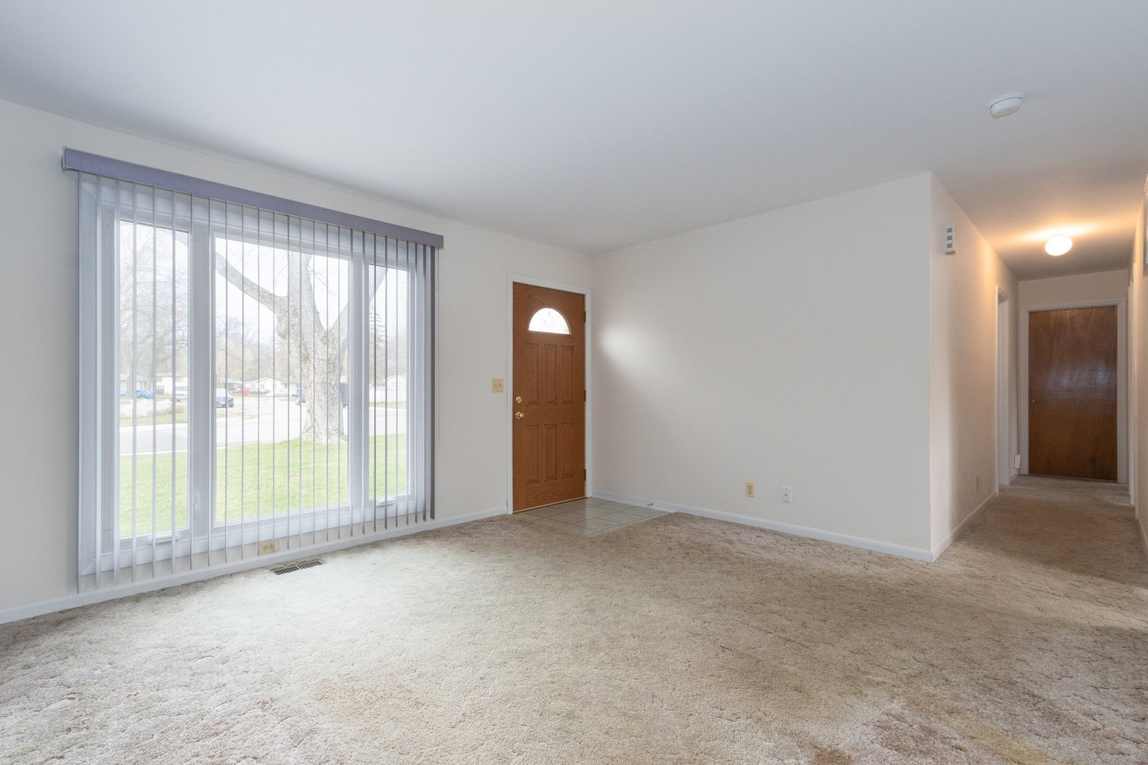 61 Sierra Road Montgomery, IL 60538 - Photo 2 of 15 a view of an empty room with glass door