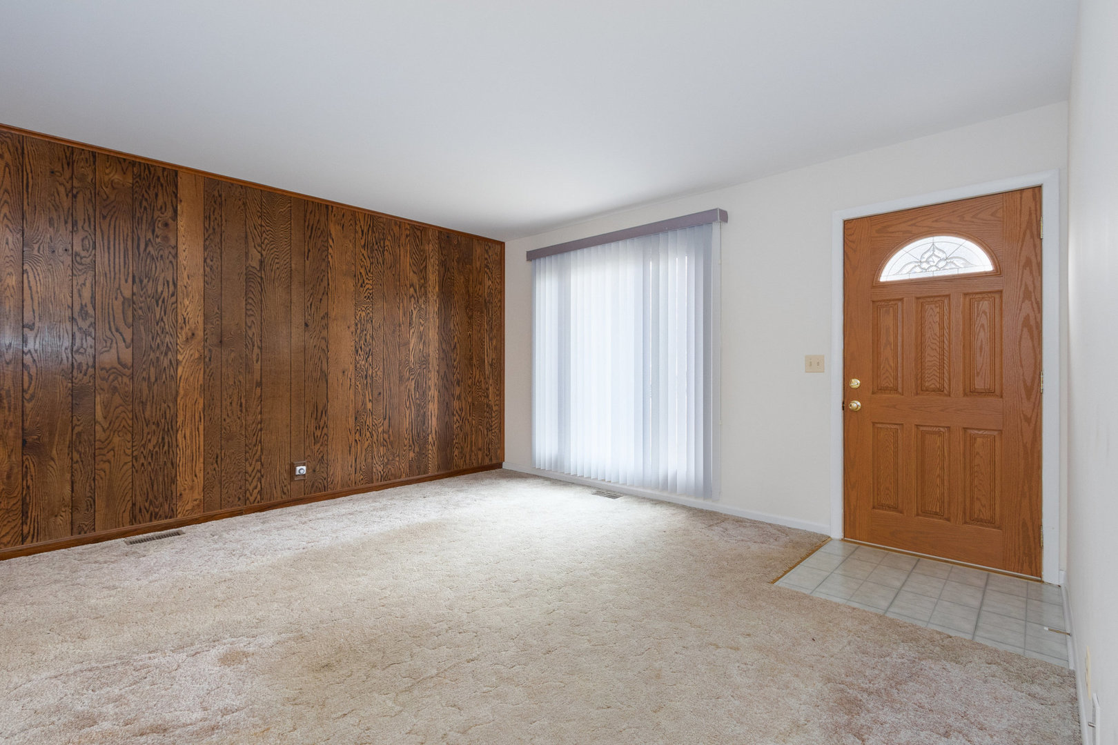 61 Sierra Road Montgomery, IL 60538 - Photo 3 of 15 a view of an empty room and a window