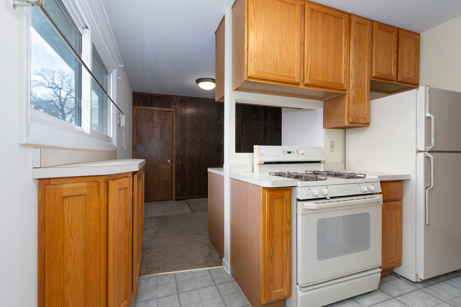61 Sierra Road Montgomery, IL 60538 - Photo 6 of 15 a kitchen with stainless steel appliances granite countertop a stove and a refrigerator