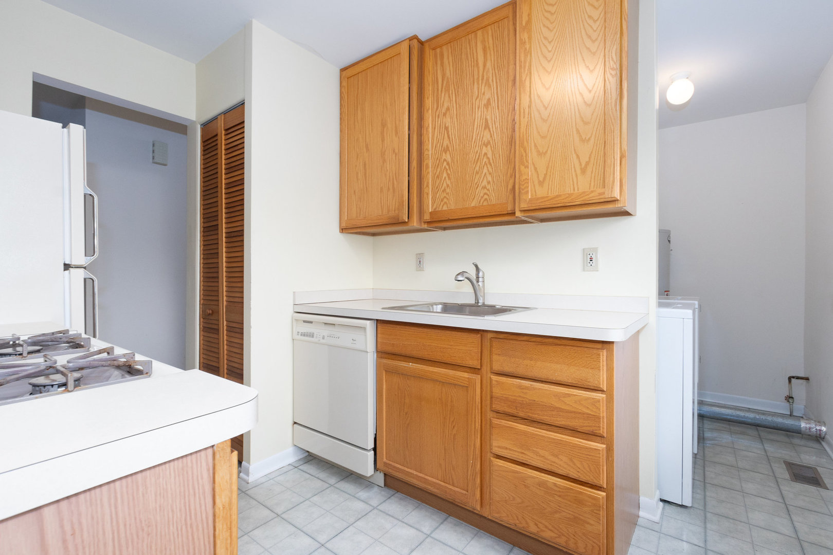61 Sierra Road Montgomery, IL 60538 - Photo 8 of 15 a kitchen with stainless steel appliances granite countertop a sink stove and cabinets