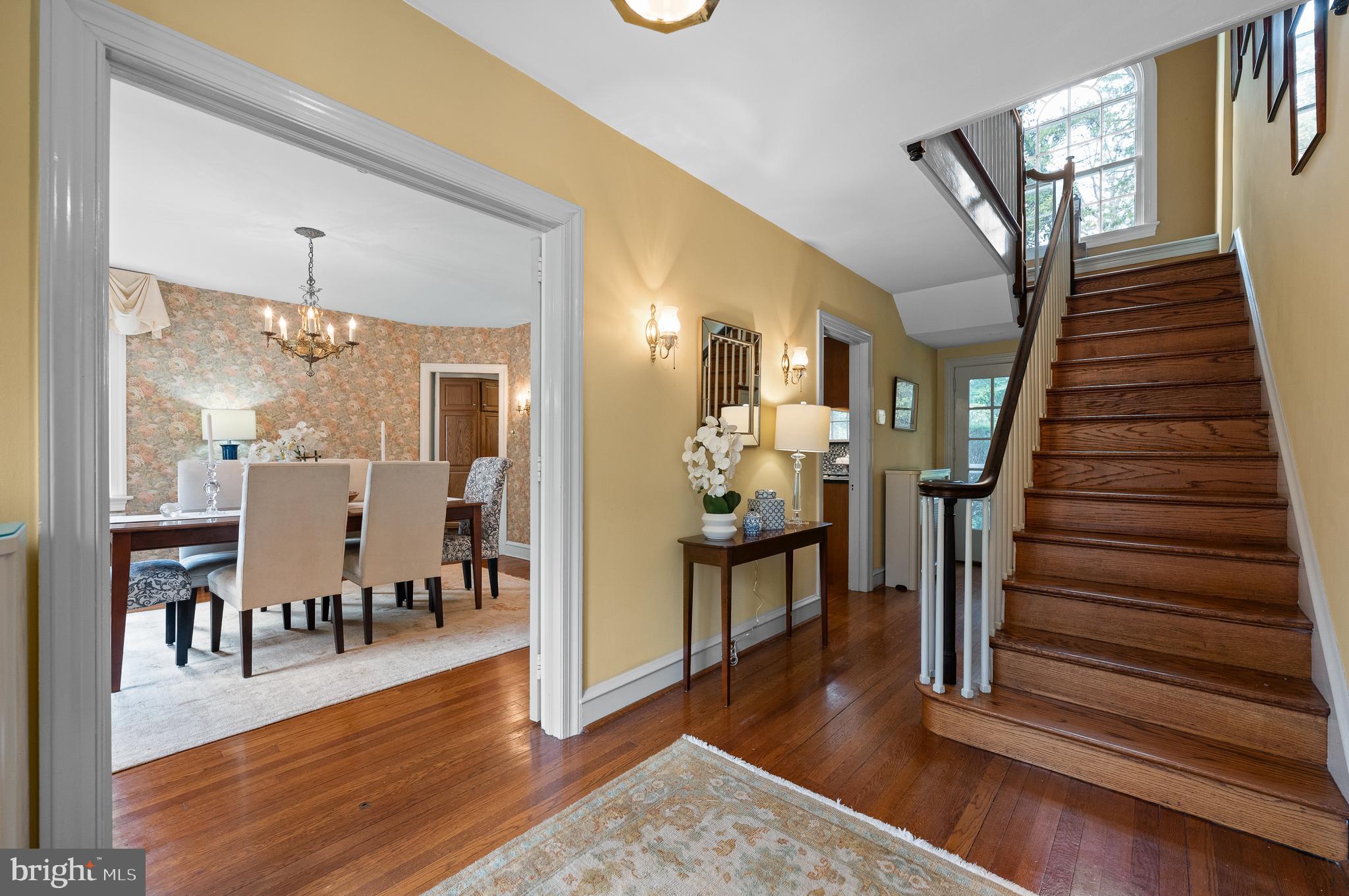 3 Canterbury Lane Wayne, PA 19087 - Photo 17 of 57 a view of a hallway with wooden floor and dining room view