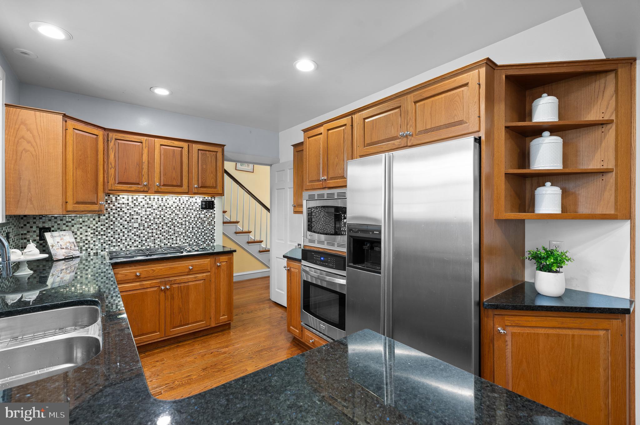 3 Canterbury Lane Wayne, PA 19087 - Photo 21 of 57 a kitchen with stainless steel appliances granite countertop a refrigerator a stove and a sink