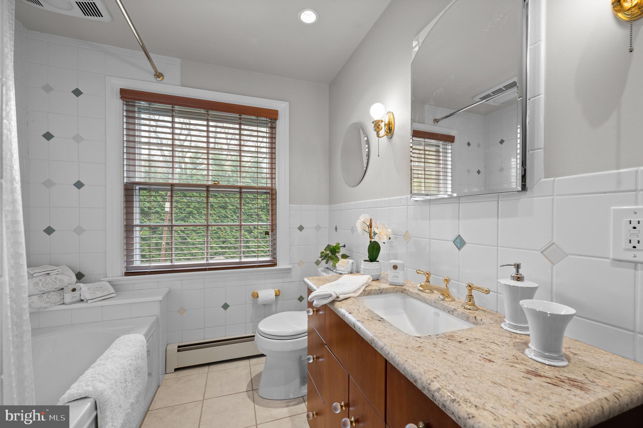 3 Canterbury Lane Wayne, PA 19087 - Photo 34 of 57 a bathroom with a granite countertop sink toilet and bathtub