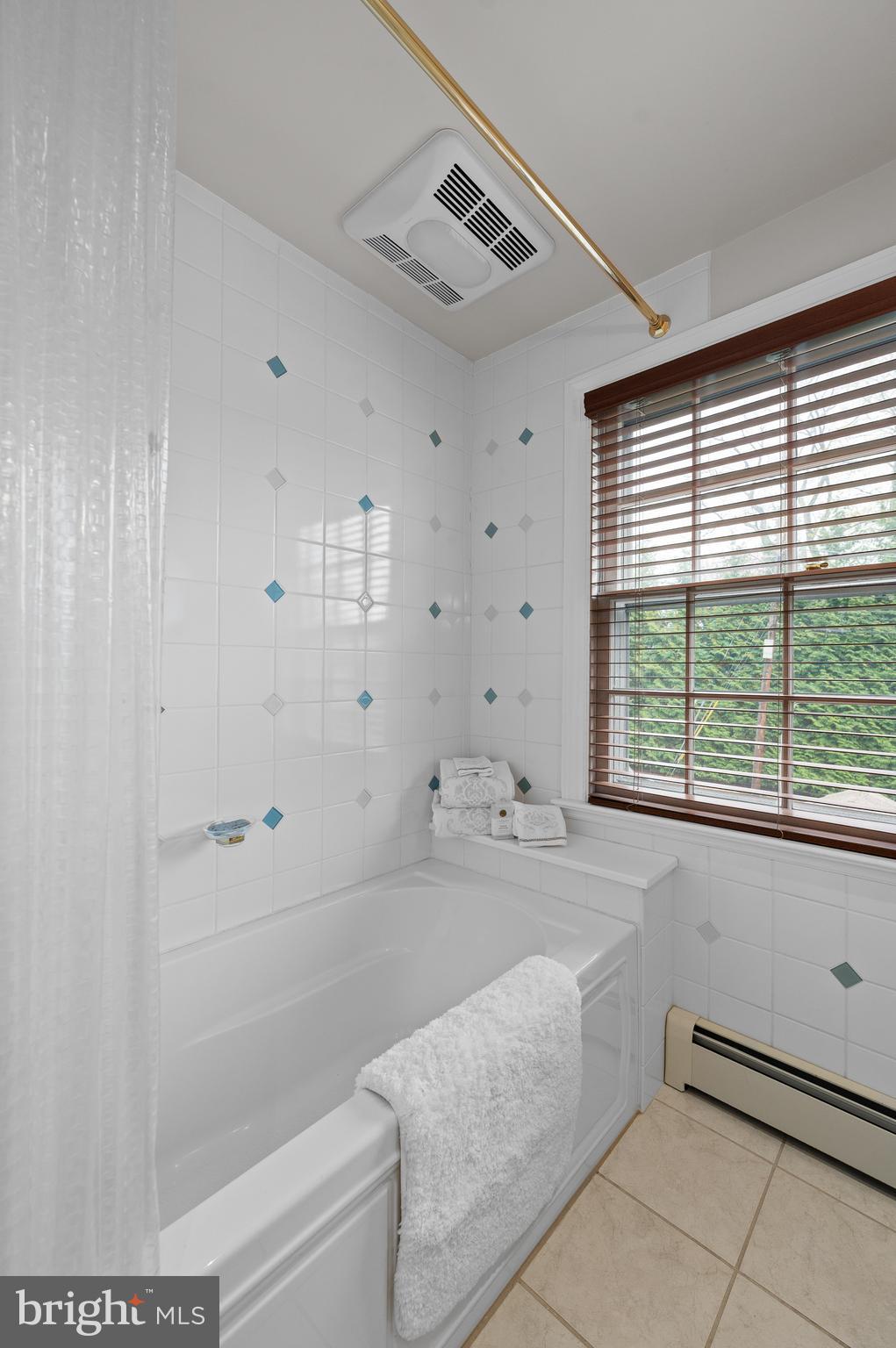 3 Canterbury Lane Wayne, PA 19087 - Photo 36 of 57 a bathroom with a bathtub and a shower