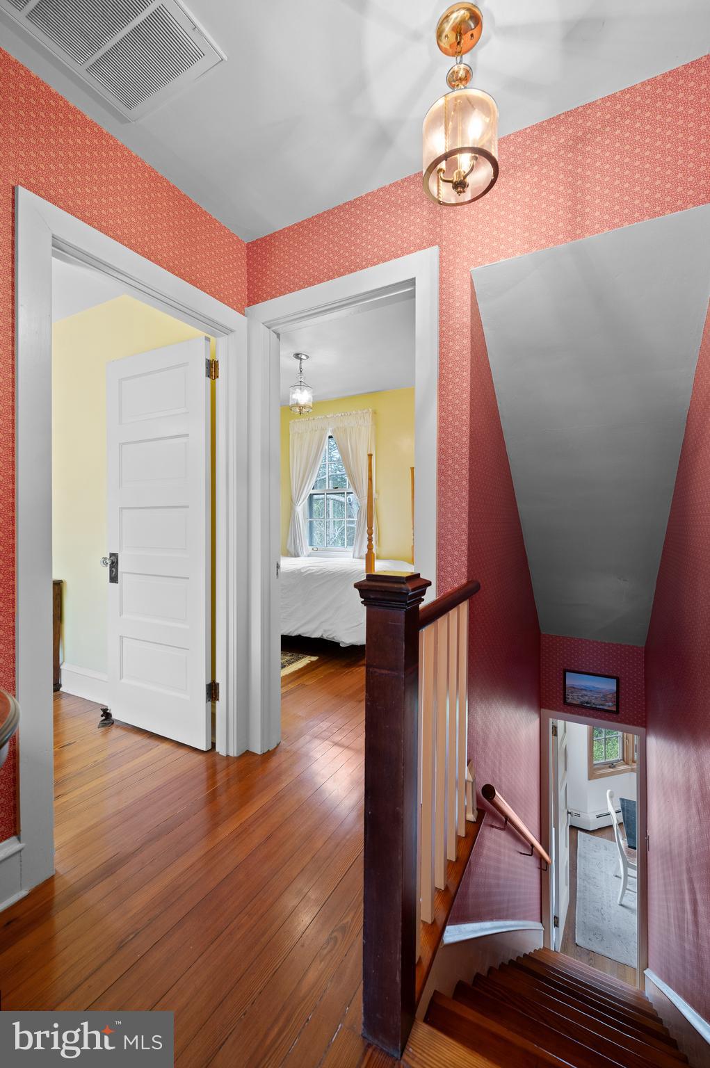 3 Canterbury Lane Wayne, PA 19087 - Photo 41 of 57 a view of a hallway with wooden floor and staircase