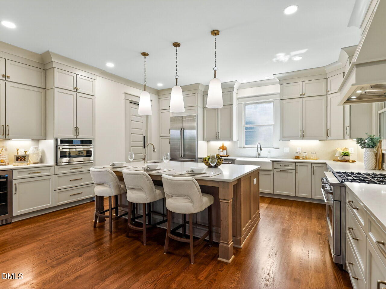 504 Tilden Street Raleigh, NC 27605 - Photo 2 of 58 a kitchen with kitchen island granite countertop a sink counter and chairs