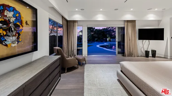 a lobby with a couch and a flat screen tv