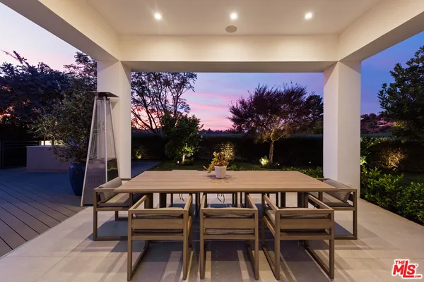 a view of a table and chairs in patio