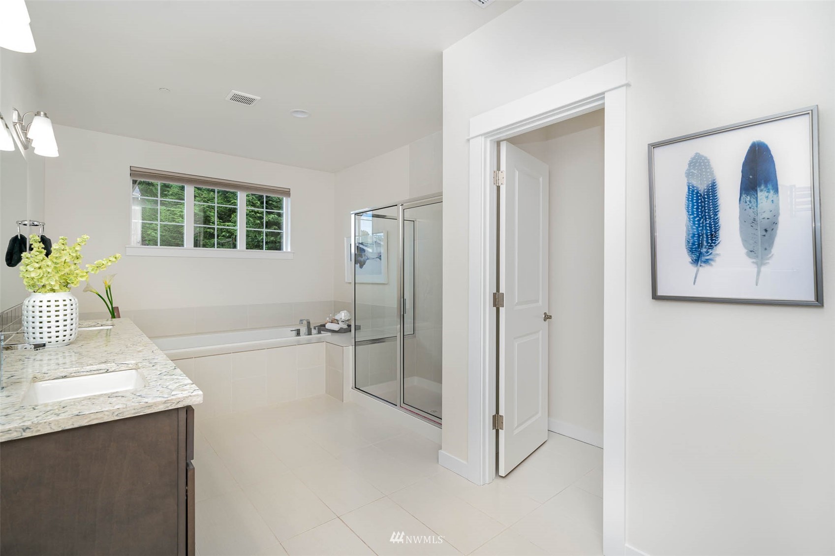 10133 Northeast 147th Street Bothell, WA 98011 - Photo 18 of 39 a bathroom with a tub sink and mirror