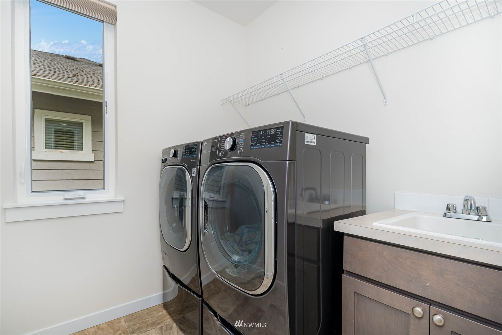 10133 Northeast 147th Street Bothell, WA 98011 - Photo 29 of 39 a utility room with dryer and washer