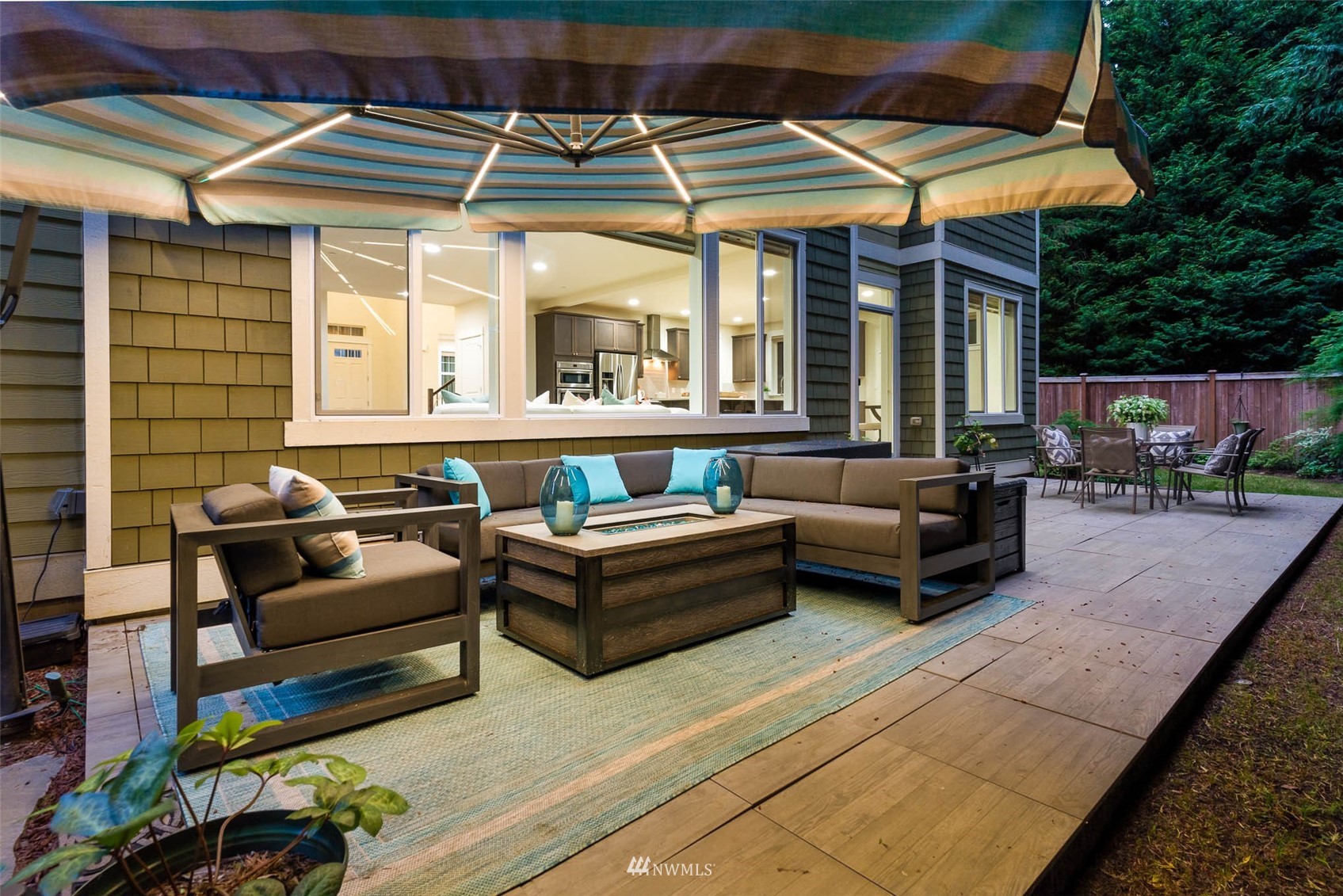 10133 Northeast 147th Street Bothell, WA 98011 - Photo 35 of 39 a view of a patio with couches and a table and chairs