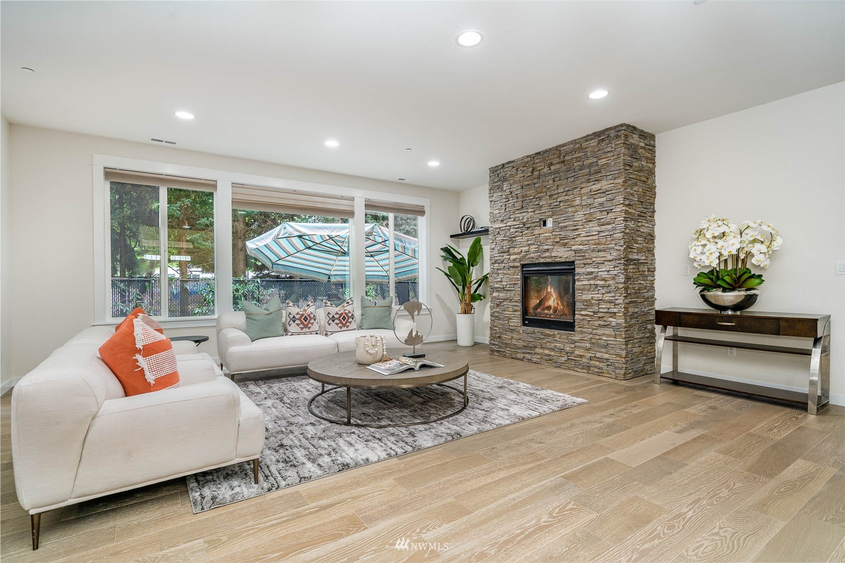 10133 Northeast 147th Street Bothell, WA 98011 - Photo 4 of 39 a living room with furniture fireplace and a large window