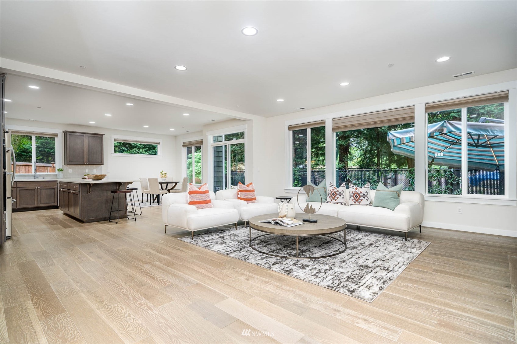 10133 Northeast 147th Street Bothell, WA 98011 - Photo 5 of 39 a living room with furniture and large windows