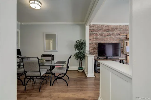 a view of a livingroom with furniture and a flat screen tv
