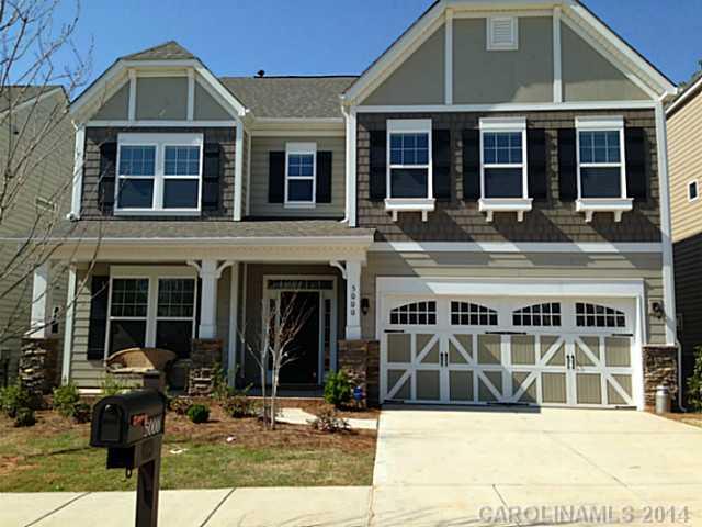 5000 Fallondale Road, Unit 885 Waxhaw, NC 28173 - Photo 1 of 16 a front view of a house with glass windows