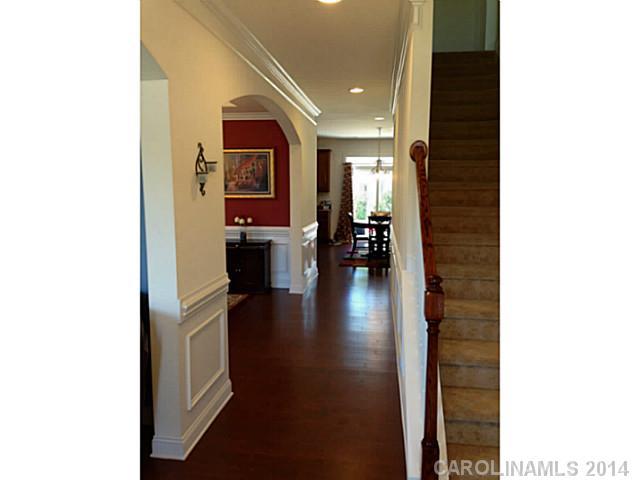 5000 Fallondale Road, Unit 885 Waxhaw, NC 28173 - Photo 3 of 16 a hallway with a large mirror and entryway