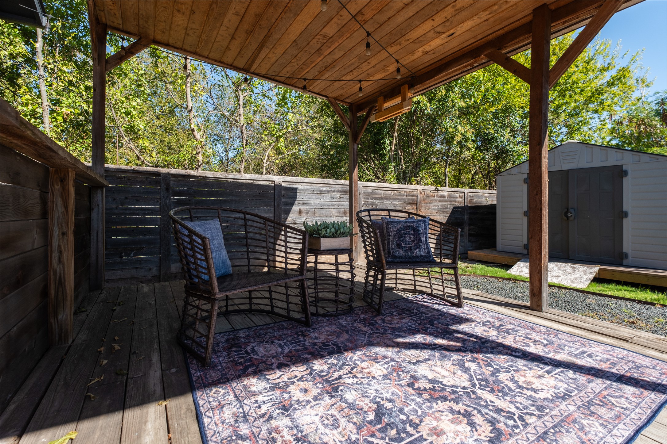 7601 Bethune Avenue, Unit B Austin, TX 78752 - Photo 32 of 39 Deck featuring a shed and a fenced backyard