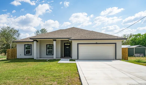 front view of a house with a yard