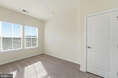 a view of a room with a hallway