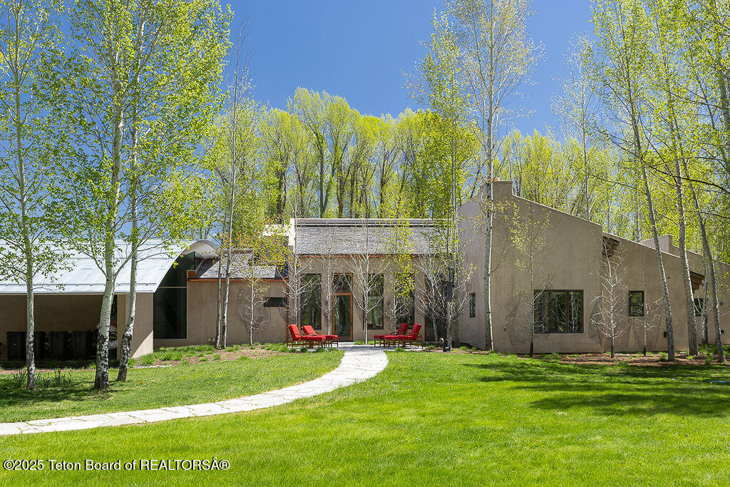1120 Thunder Road Wilson, WY 83014 - Photo 35 of 38 Living Room Exterior Side Yard