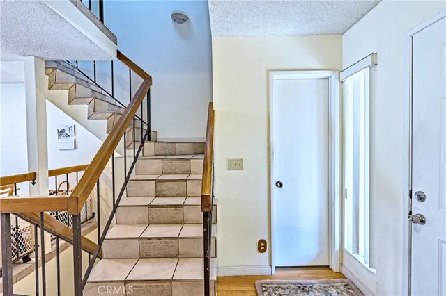 a view of a livingroom with wooden floor and a window