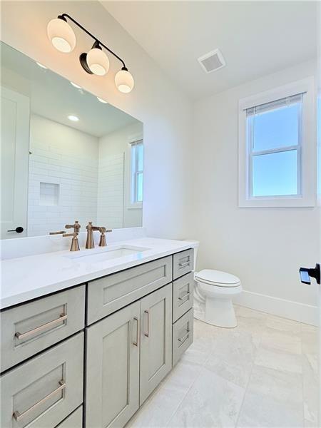 122 Palisade Drive Rydal, GA 30171 - Photo 46 of 54 a bathroom with a granite countertop sink mirror and toilet