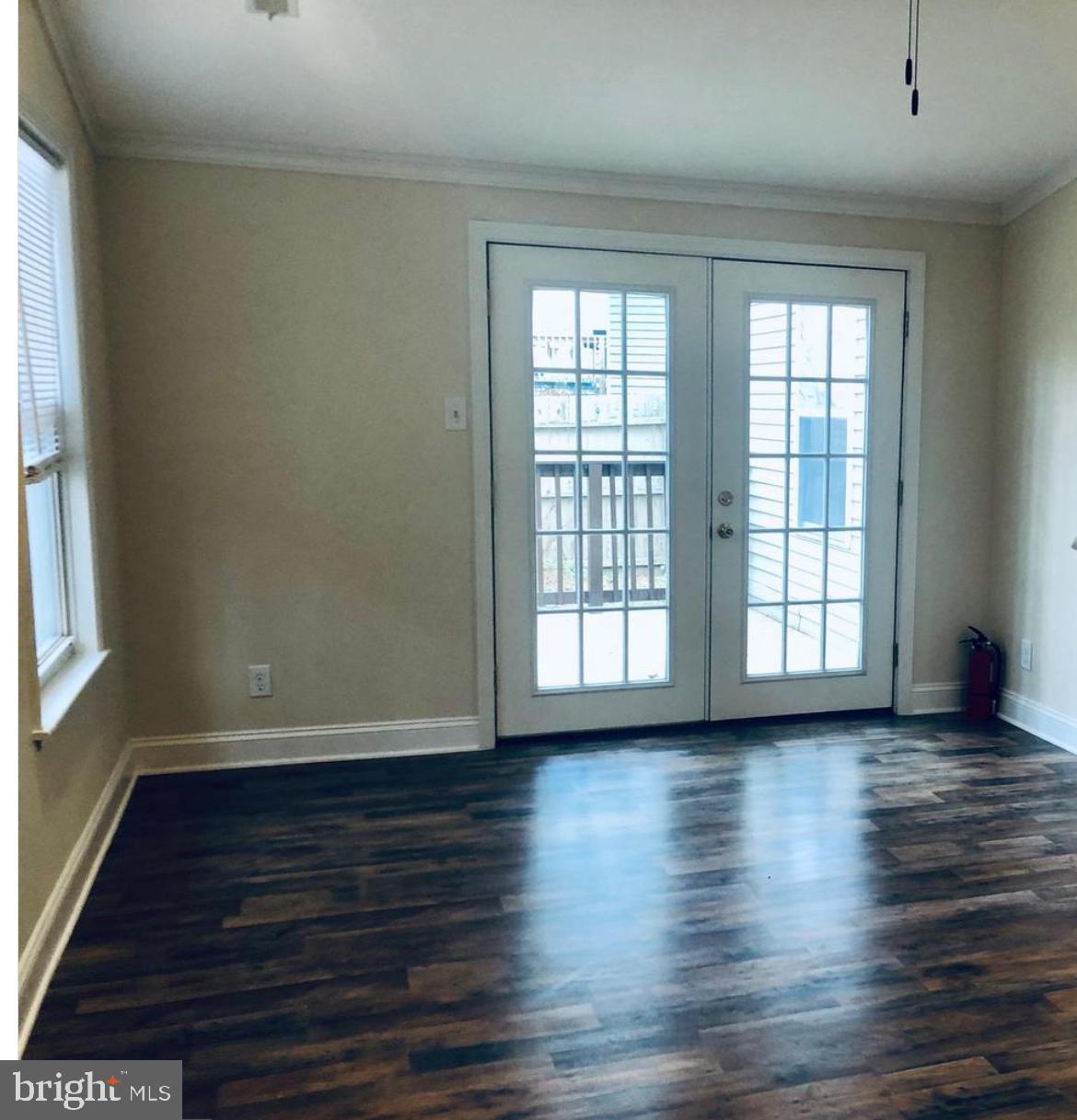 7 Haddon Court Marlton, NJ 08053 - Photo 5 of 8 a view of an empty room with wooden floor and a window