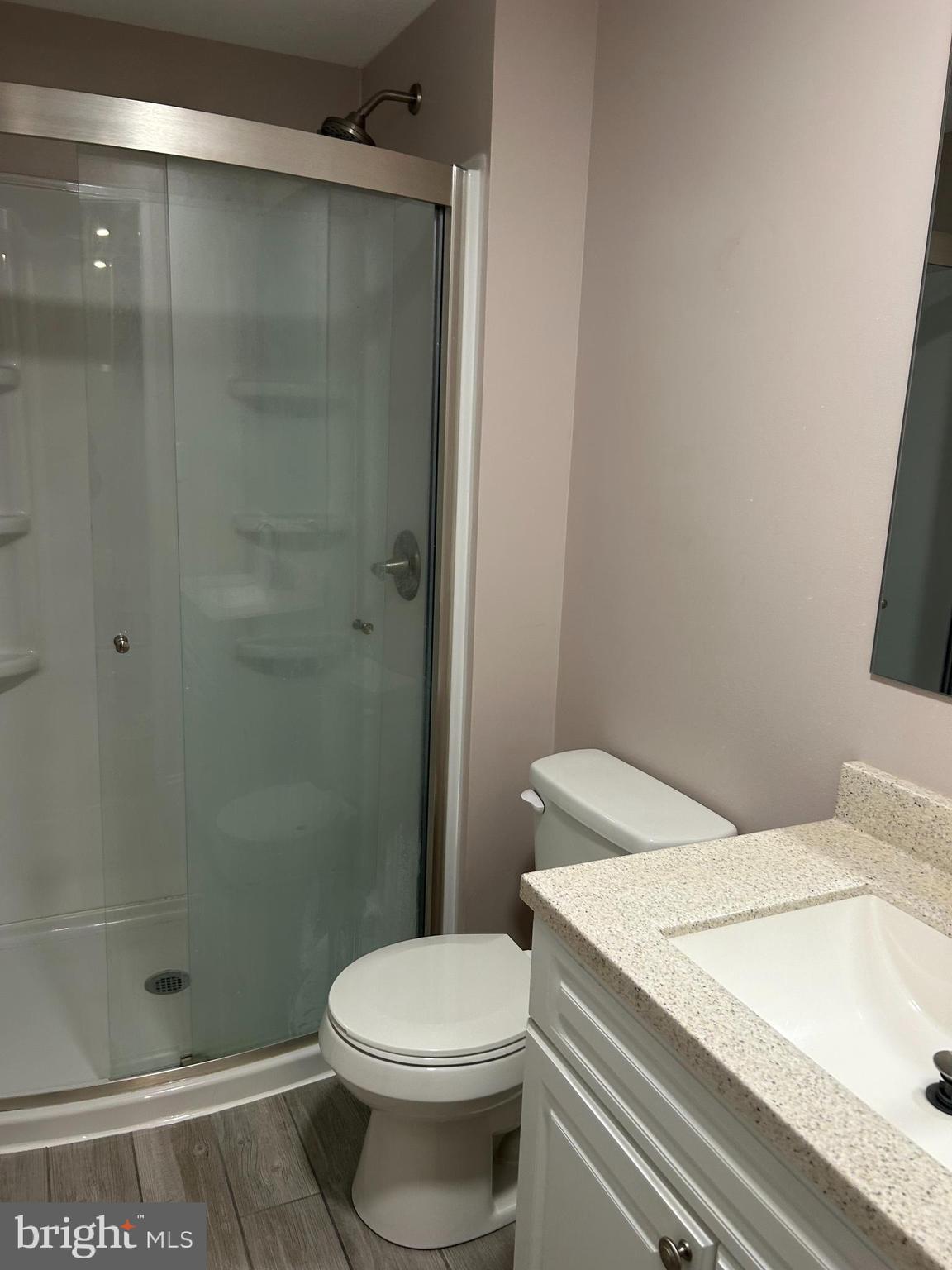 7 Haddon Court Marlton, NJ 08053 - Photo 7 of 8 a white toilet sitting next to a shower