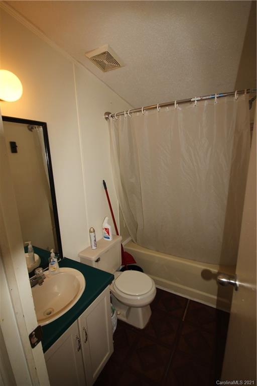 130 Basinger Kluttz Road Salisbury, NC 28146 - Photo 14 of 20 a bathroom with a sink a toilet and a mirror