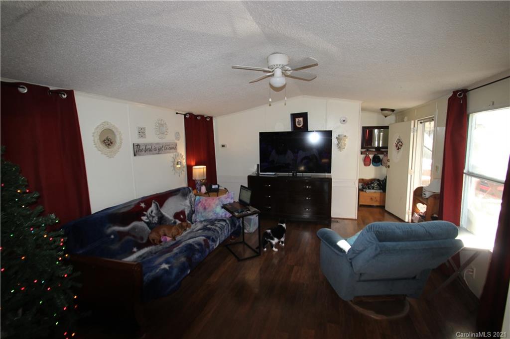 130 Basinger Kluttz Road Salisbury, NC 28146 - Photo 3 of 20 a living room with furniture and a flat screen tv