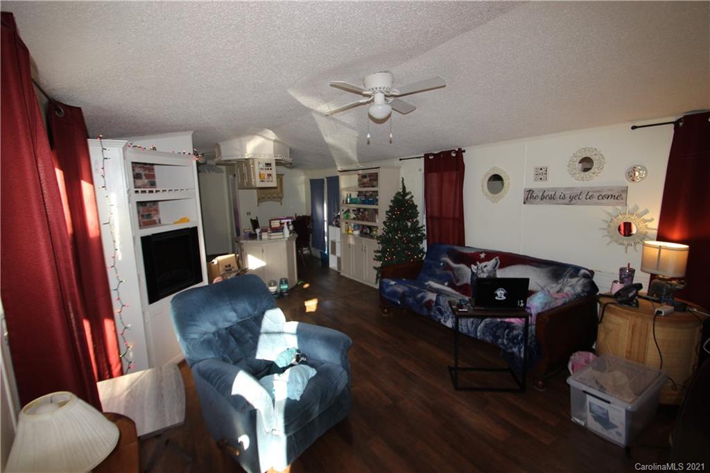 130 Basinger Kluttz Road Salisbury, NC 28146 - Photo 4 of 20 a living room with furniture fireplace and flat screen tv