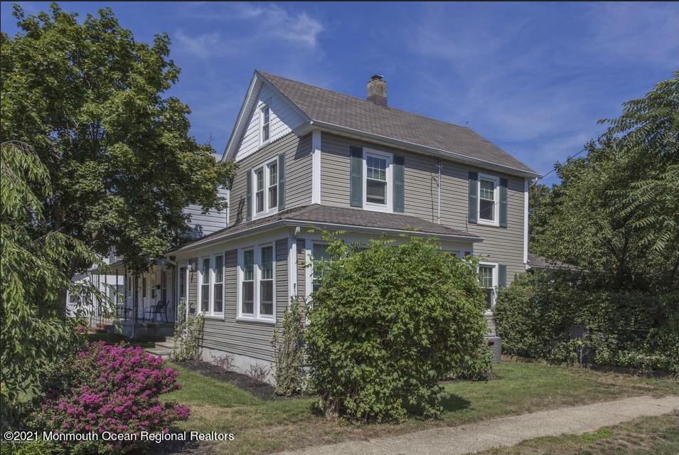 104 Bank Street Red Bank, NJ 07701 - Photo 20 of 33 a front view of a house with a yard
