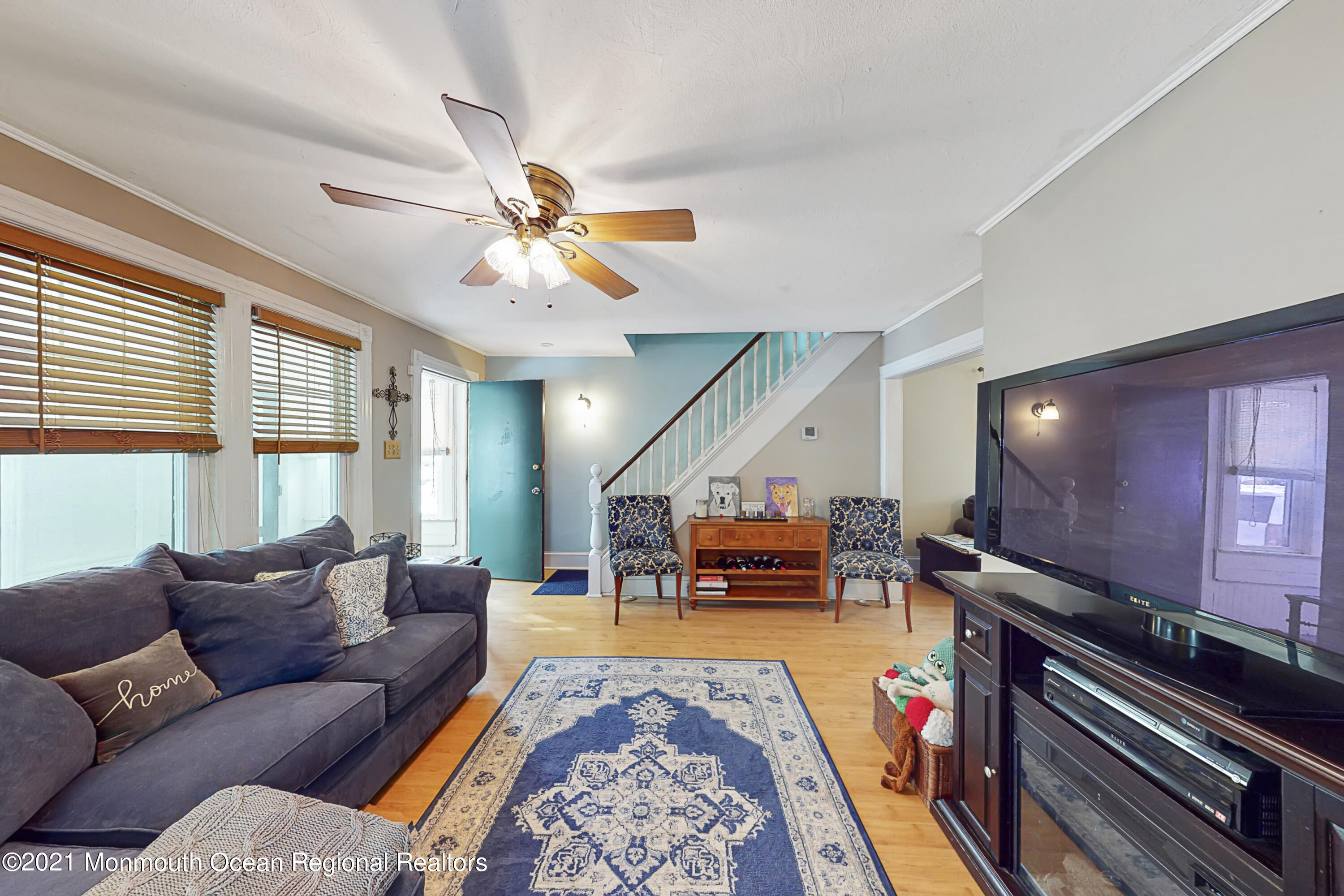 104 Bank Street Red Bank, NJ 07701 - Photo 5 of 33 a living room with furniture and a flat screen tv