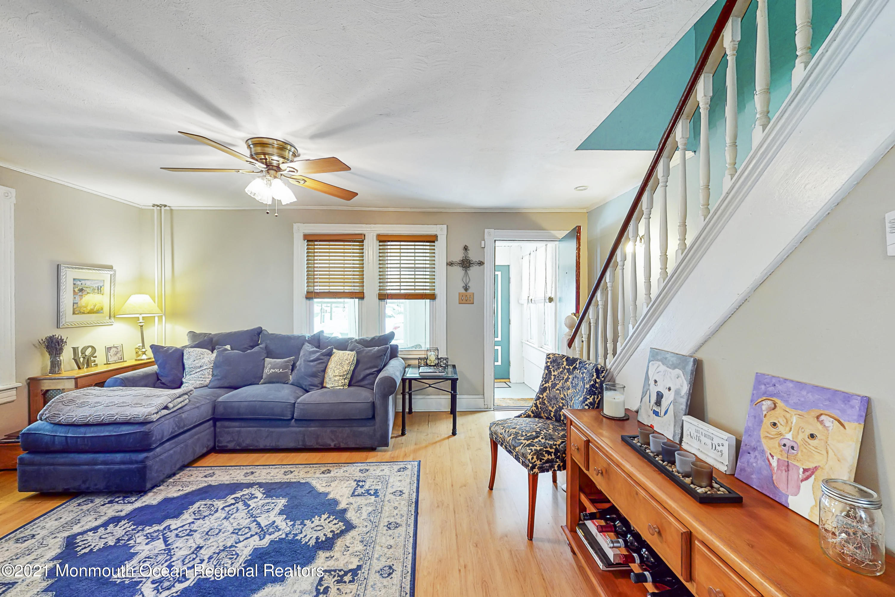 104 Bank Street Red Bank, NJ 07701 - Photo 6 of 33 a living room with furniture and a chandelier