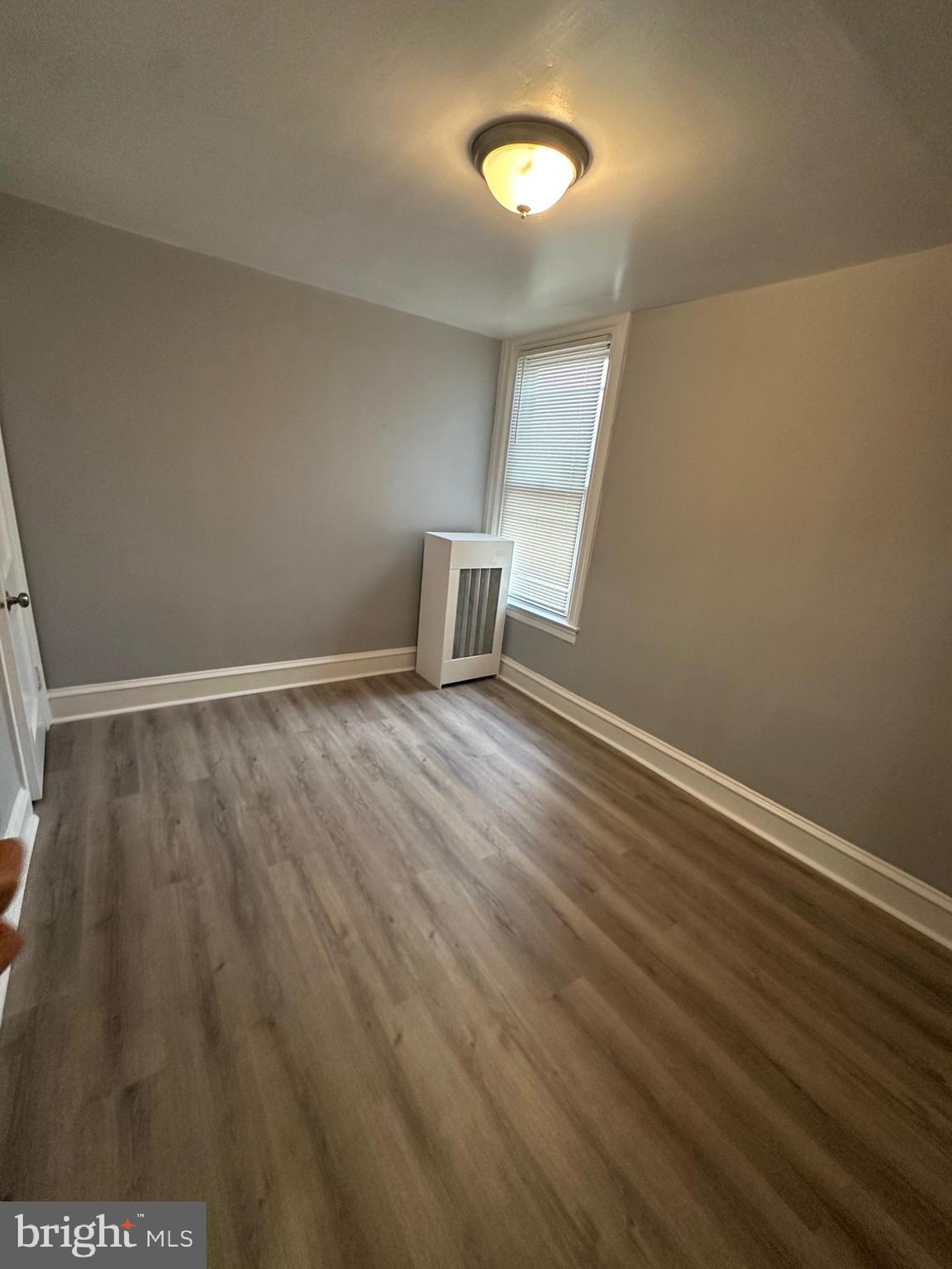 5935 Agusta Street Philadelphia, PA 19149 - Photo 8 of 13 a view of an empty room with wooden floor