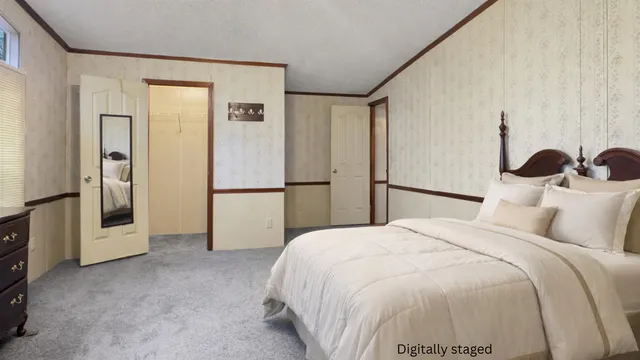 a bedroom with a bed and a refrigerator