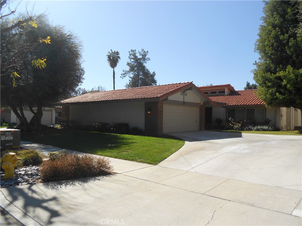 622 Vía Zapata Riverside, CA 92507 - Photo 1 of 11 a view of a house with a yard and a garage